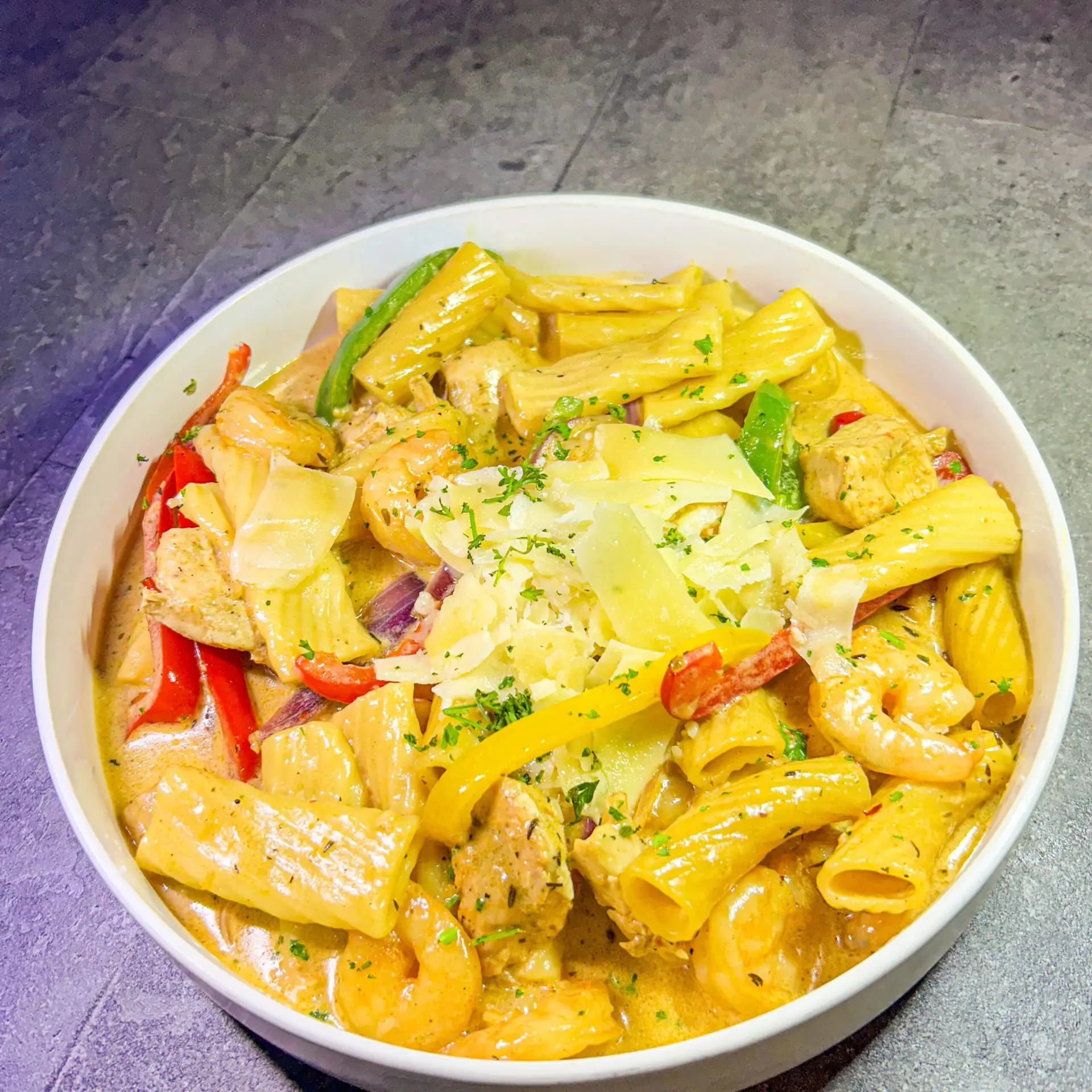 RASTA PASTA creamy pasta tossed with jerk seasoning, broccoli & bell peppers